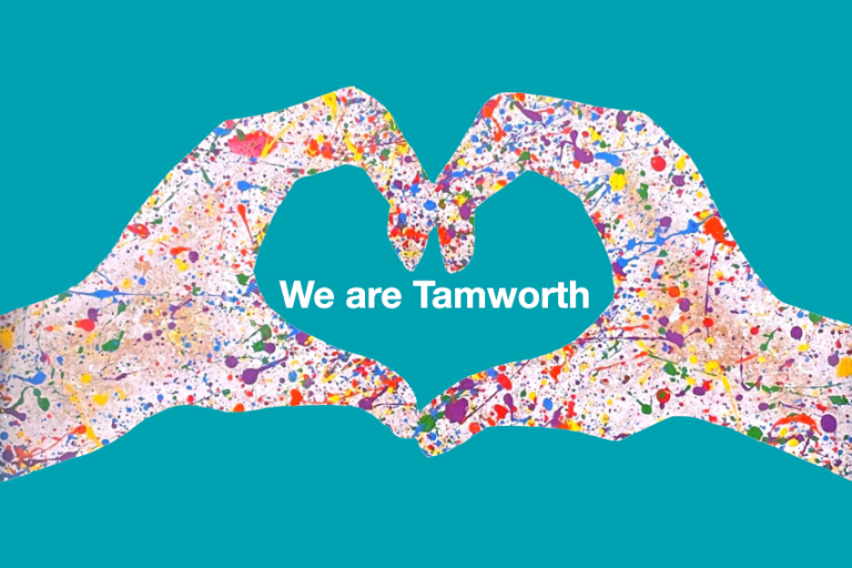 Teal background with heart hands covered in paint splashes
