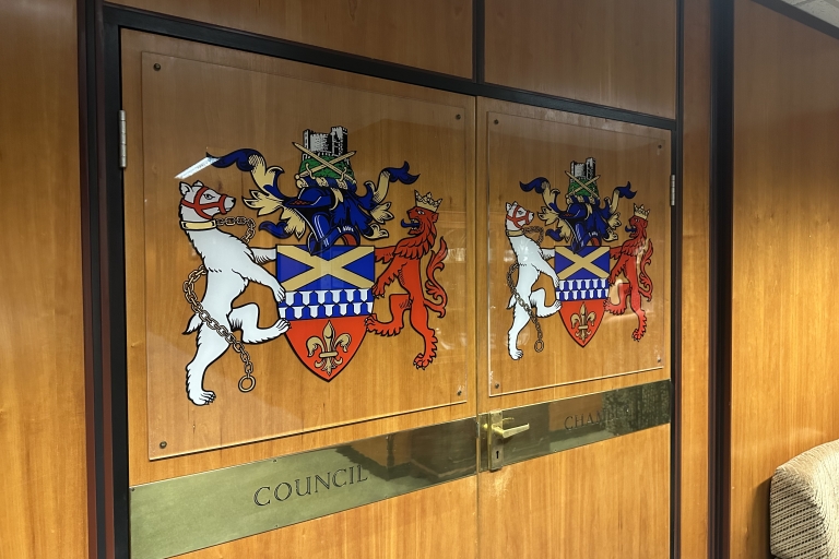 Two wooden doors with 'council chamber'