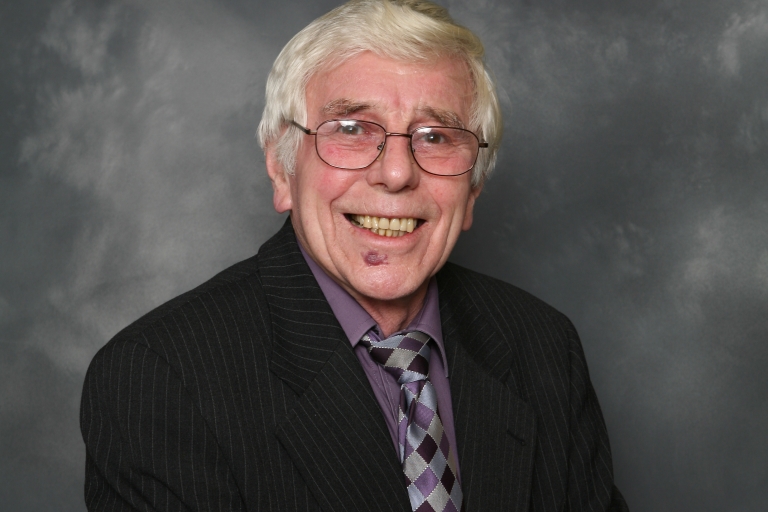 Ron Cook in a suit