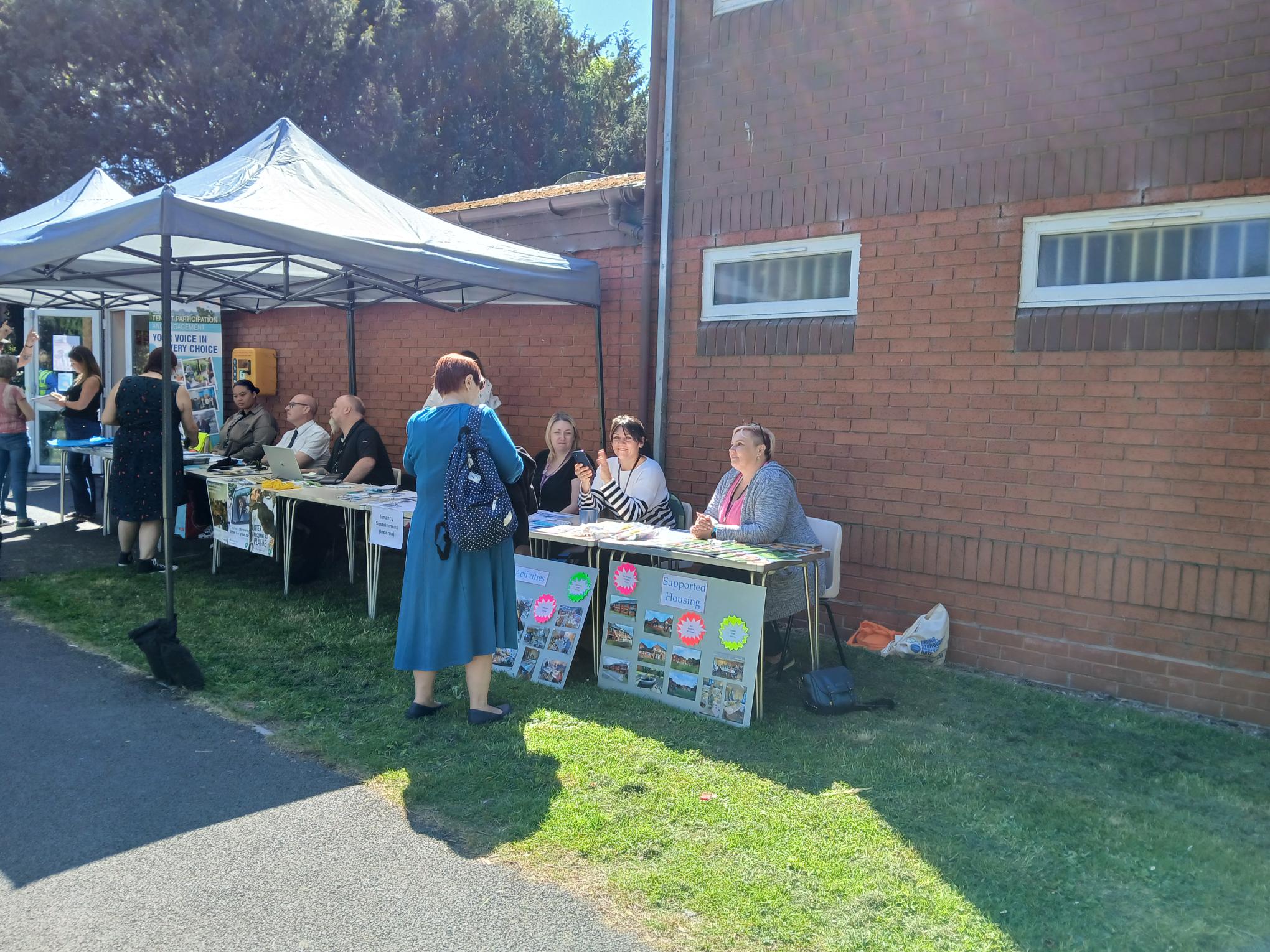 image of a gazebo and people sitting at tables