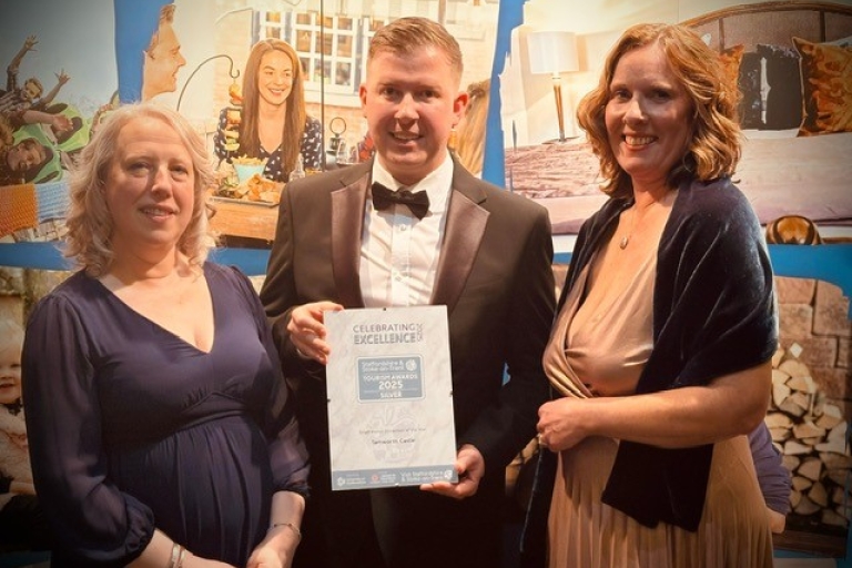 photo of Linda Baker, Tom Dodd and Lara Rowe holding a certificate