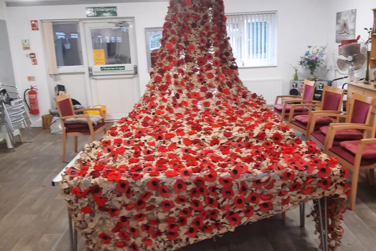 photo of a large poppy crafted display on a large table 