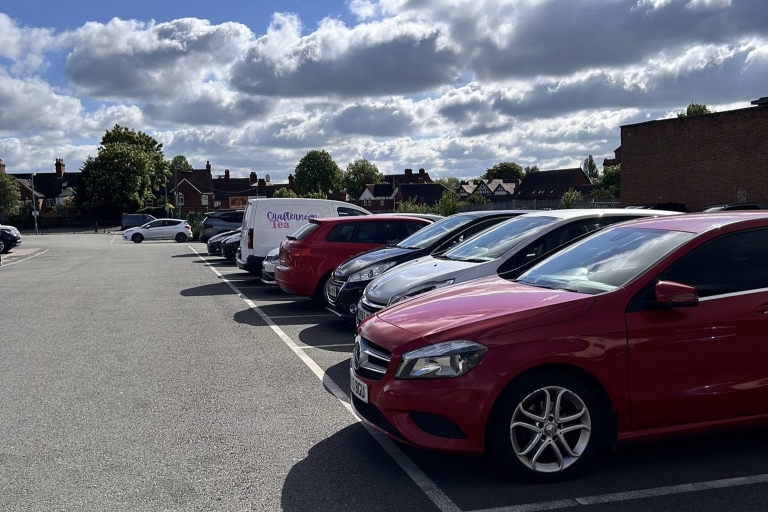 Cars parked in a line in a car park