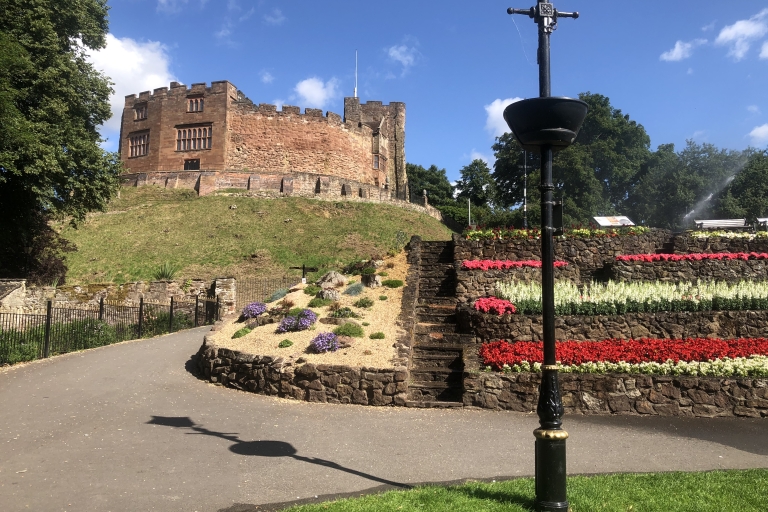 photo of a castle and flowerbeds 